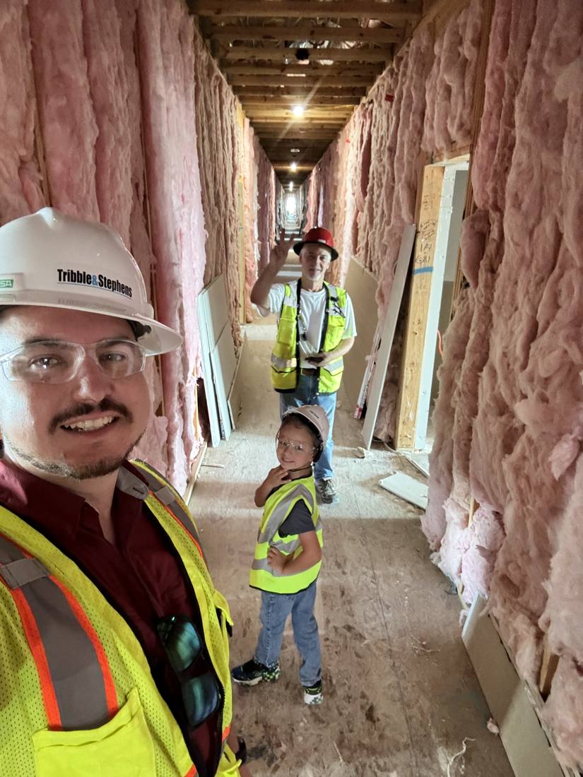 Adrian and his son on site in the Houston Heights